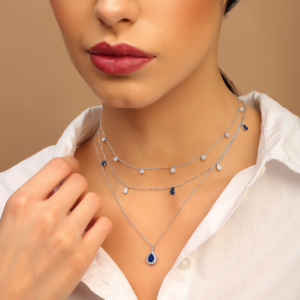 A model wearing layering choker necklaces